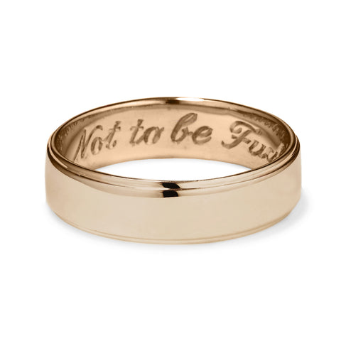 A yellow gold flat edge band in 5mm with "Not to Be F**ked With" engraved on the inside., Yellow Gold 2