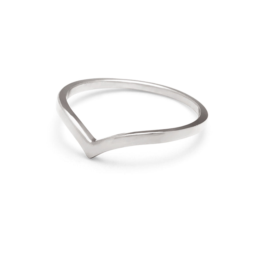 Angled view of a solid gold band in a pointed shape set in white gold.