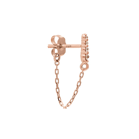 A single earring with four champagne diamonds with a chain connecting to the ear back set in rose gold. 6