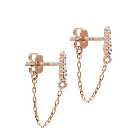 A pair of earrings with four white diamonds with a chain connecting to the ear back set in rose gold., Rose Gold 4