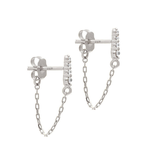 A pair of earrings with four white diamonds with a chain connecting to the ear back set in white gold., White Gold 5