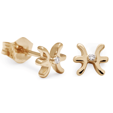 A pair of Pisces stud earrings set in yellow gold with a white diamond accent stone with one earring angled.