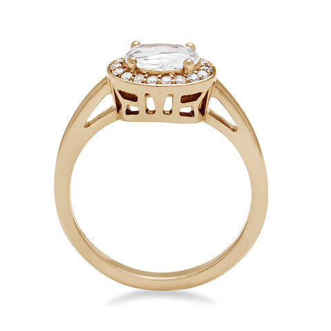 Side view of an engagement ring with a rose cut and oval shape white diamond center stone surrounded by a white diamond pave halo set in yellow gold. 2