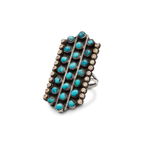A rectangular shaped, one of a kind ring with turquoise and white diamond stones set in sterling silver.