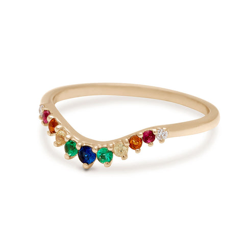Angled view of a curved 11 rainbow colored gemstones band set in yellow gold. 3