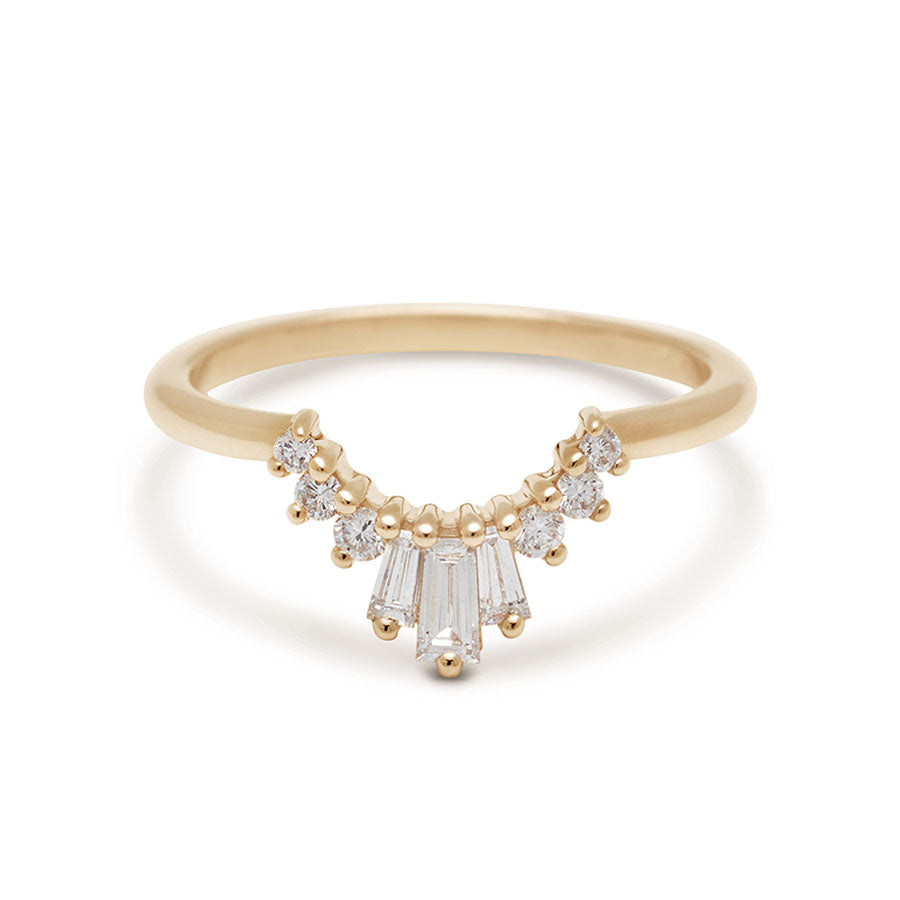 A three white diamond baguette band with three round white diamonds on either side set in yellow gold., Yellow Gold