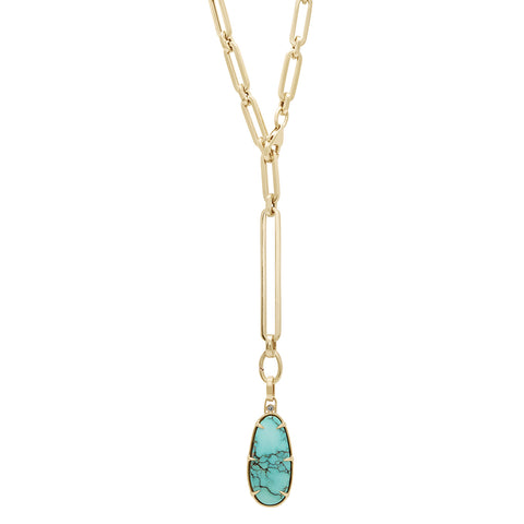 A turquoise charm in a bezel setting with claw prongs set in yellow gold with grey diamond accent stone on a mixed link yellow gold chain.