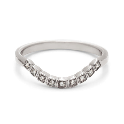 A curved 9 white diamond band set in white gold.