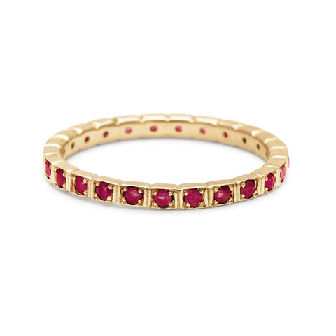 A straight band with rubies set in eternity around the band set in yellow gold., Yellow Gold