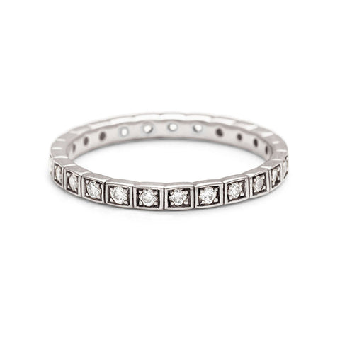 A straight band with white diamonds set in eternity around the band set in platinum.