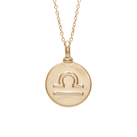 A 14mm charm with the Libra zodiac sign set in yellow gold on a yellow gold chain.
