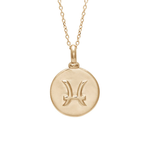 A 14mm charm with the Pisces zodiac sign set in yellow gold on a yellow gold chain.