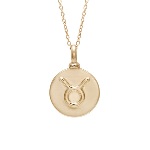 A 14mm charm with the Taurus zodiac sign set in yellow gold on a yellow gold chain.