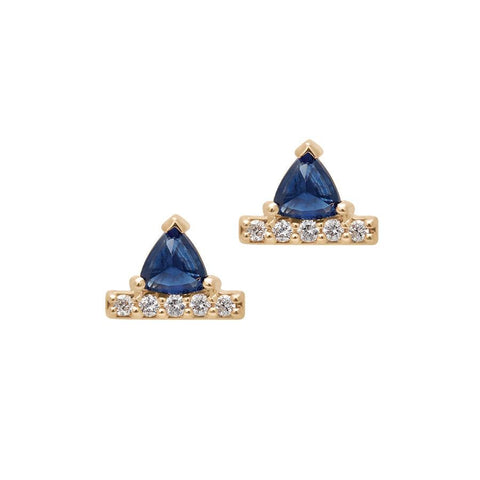 A pair of earrings with sapphire trillions set above a line of white diamond pave set in yellow gold.