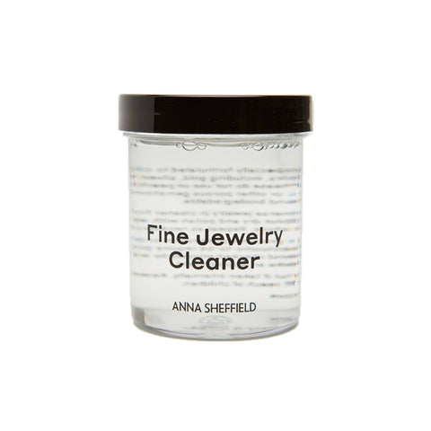 "Anna Sheffield Fine Jewelry Cleaner" in a small jar with clear liquid.