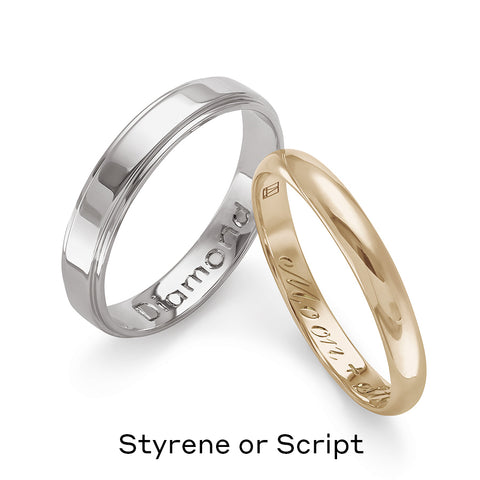 Two solid gold wedding bands one in white gold engraved with “Diamond” on the inside and one in yellow gold with “Moon + Stars” engraved on the inside. 3