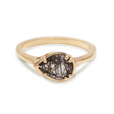 A pear shaped ring with a black rutilated stone set in yellow gold., Yellow Gold