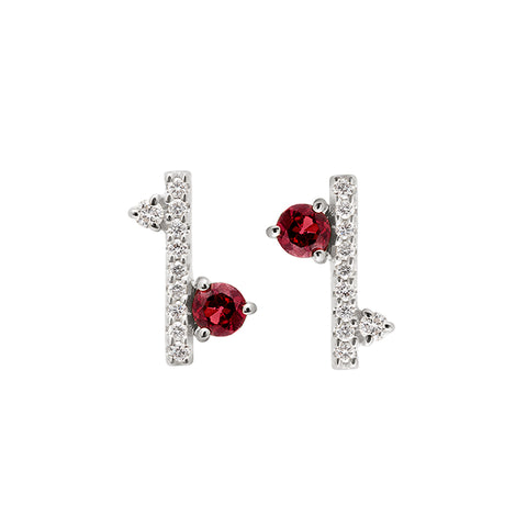 A pair of straight line of white diamond pave with a garnet accent stone on one side earrings set in white gold., White Gold 4